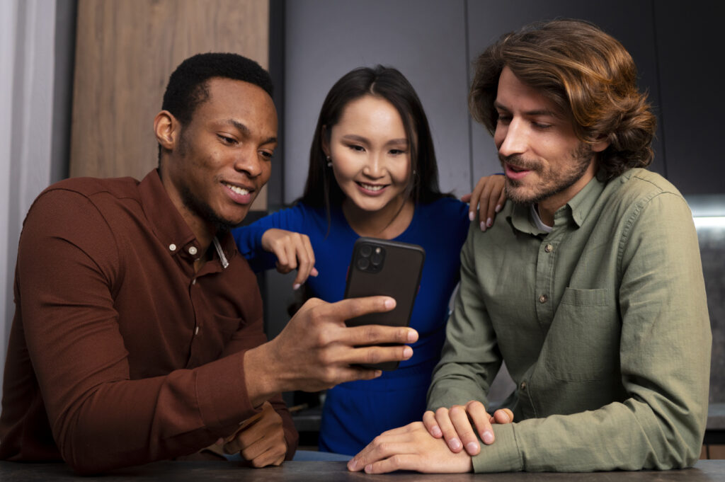 medium shot friends reading cell phone messages